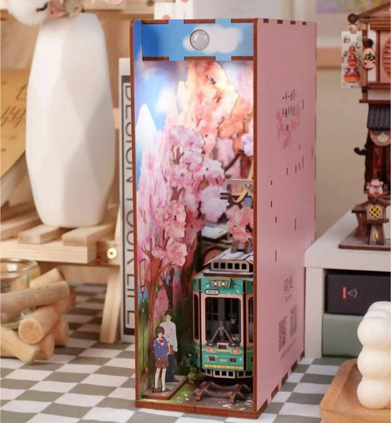 Japanese Sakura Densya DIY Book Nook Kit, A charming miniature 3d wooden puzzles the captures the essence of springtime in Japan, perfect for bookshelf decor or a delightful gift for Japanese culture lovers. Body Sensor Light