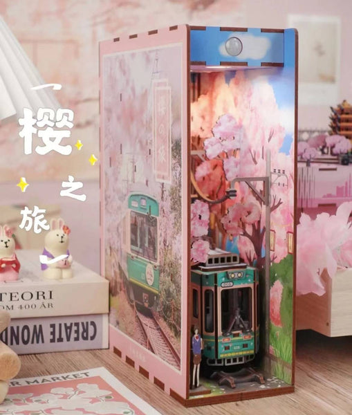 Japanese Sakura Densya DIY Book Nook Kit, A charming miniature 3d wooden puzzles the captures the essence of springtime in Japan, perfect for bookshelf decor or a delightful gift for Japanese culture lovers. Step-by-step guide